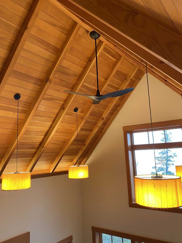 Wooden ceiling with fan and lights