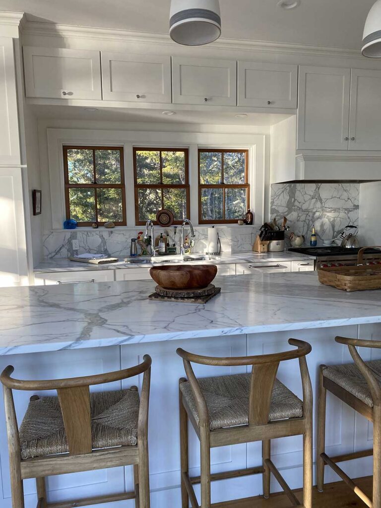 Kitchen island, cabinets and windows