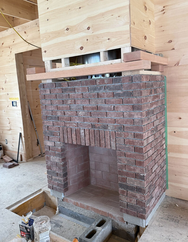 Brick fireplace at Pressey Village Home