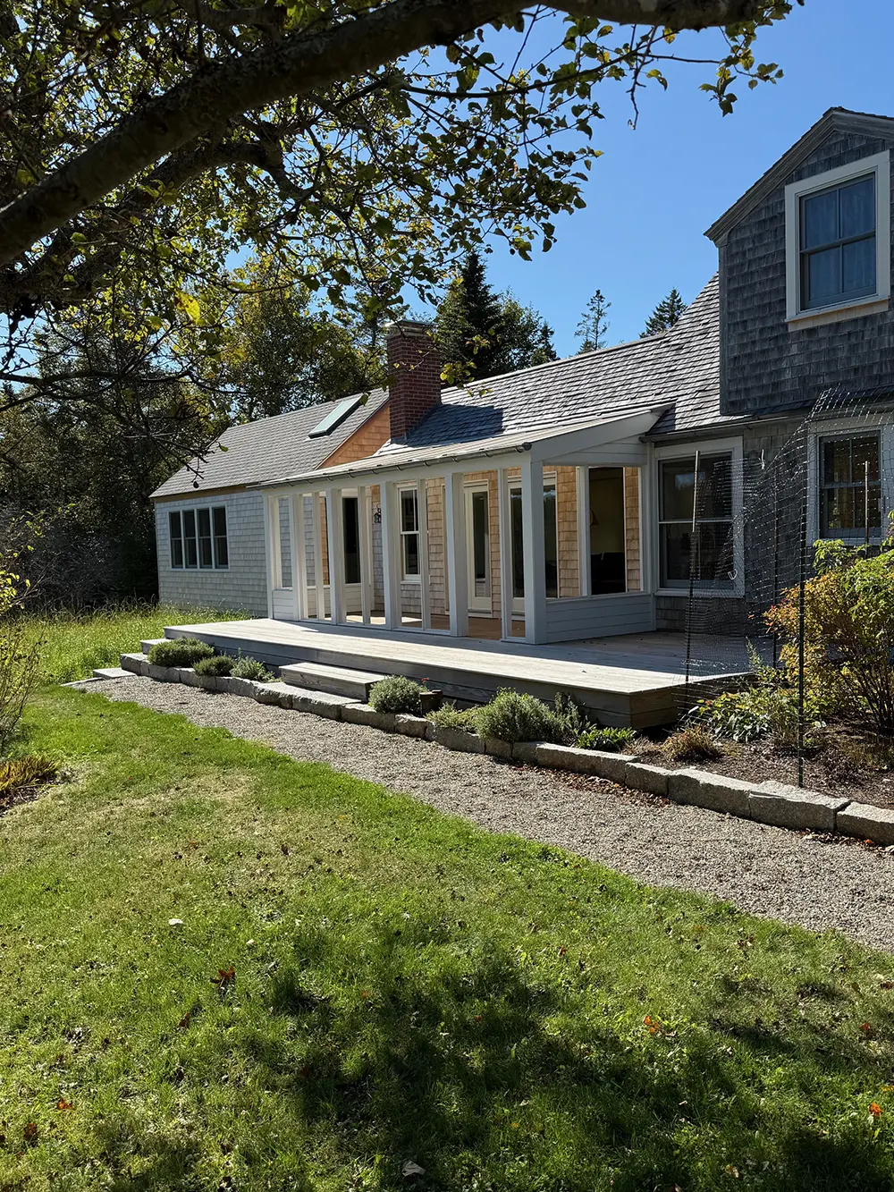 Exterior of addition at Sunshine Addition, including deck, porch, bedroom